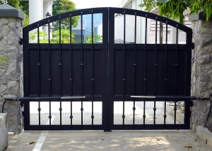 Gate Service & Install in Fort Worth - TX as a technician adjusts a residential driveway gate