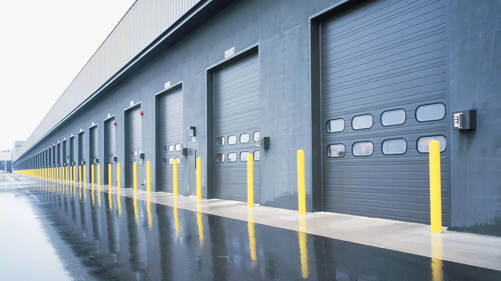 Garage Door Repair & Maintenance in Fort Worth - TX as a technician adjusts tracks on a stuck garage door, Technician performing garage door repair in a North Richland Hills - TX driveway while testing opener safety sensors, Specialist performing garage door repair on a Southlake - TX home while testing spring balance and opener travel