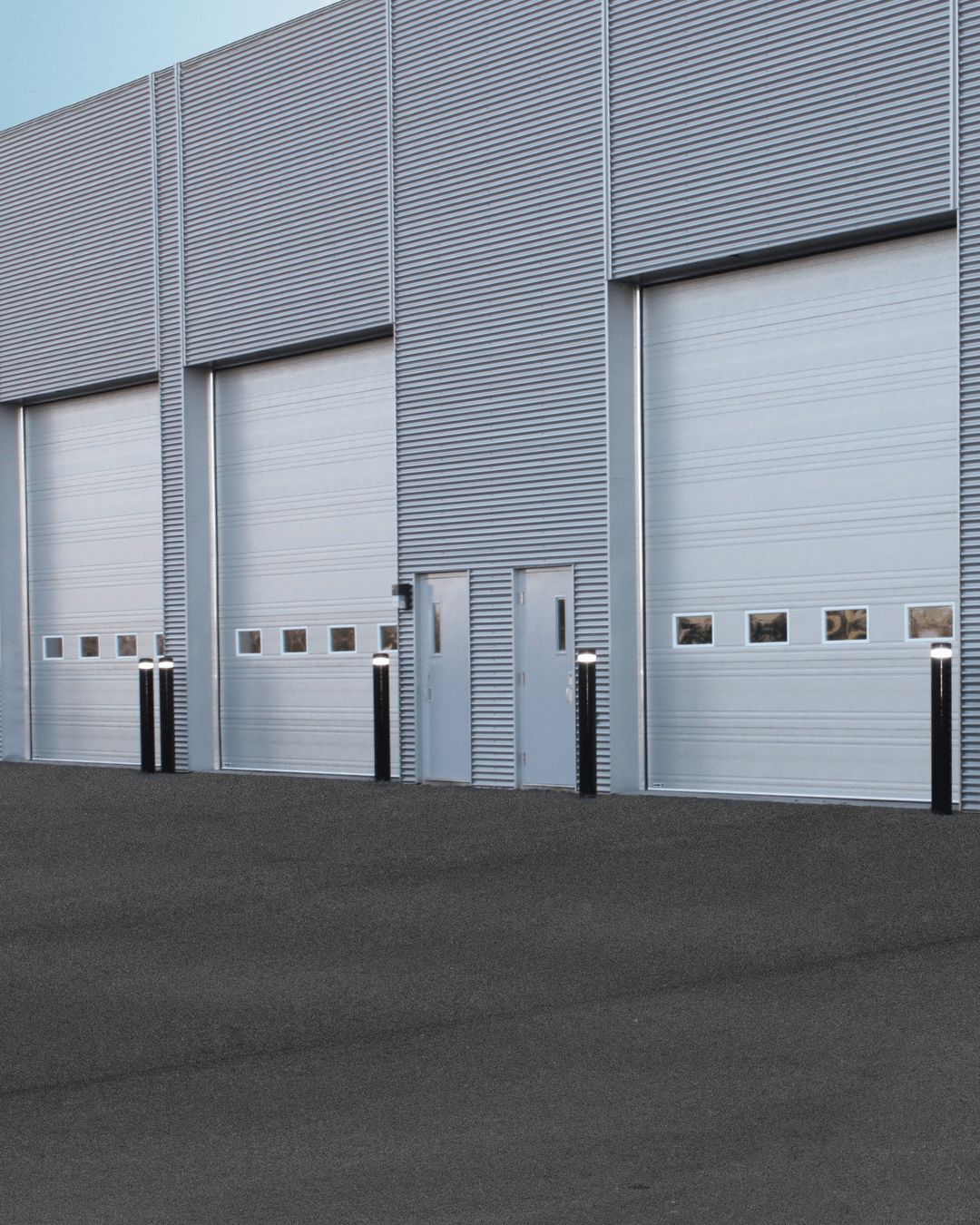 Technicians coordinating Commercial Installs inside a Fort Worth - TX service facility during equipment setup, Garage Door Repair in Hudson Oaks - TX as a technician replaces worn rollers on a residential door
